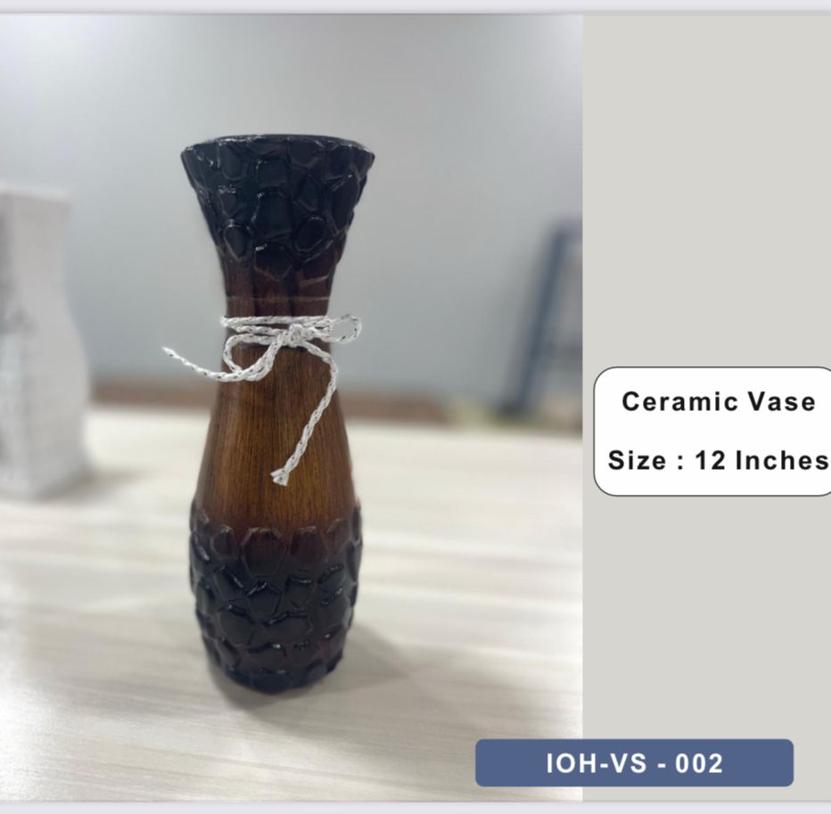 Rustic Brown Ceramic Vase with Textured Base and White Cord